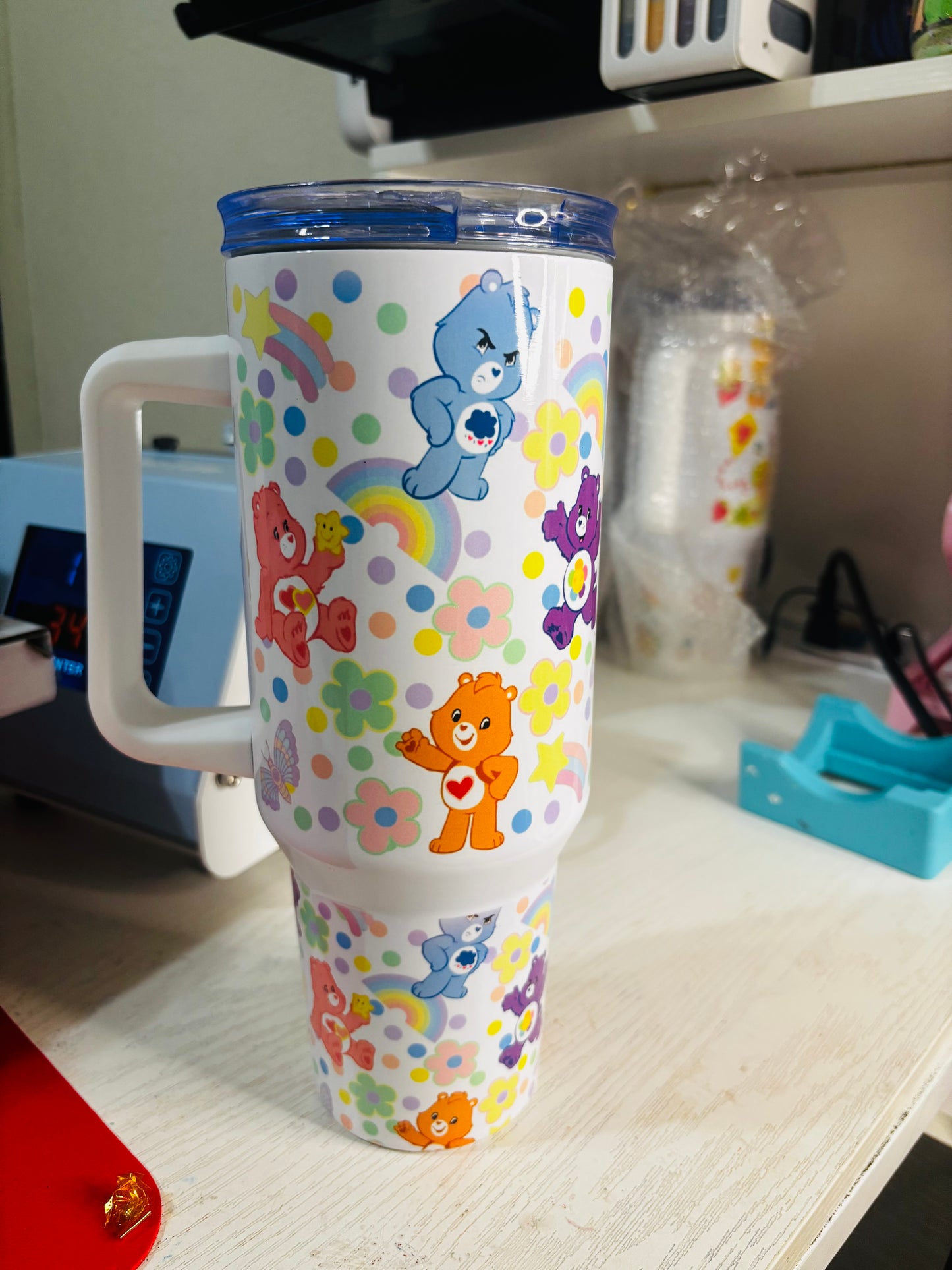 Flowers and rainbow carebears 40oz tumbler